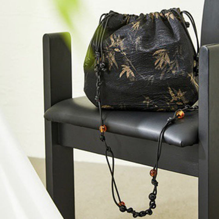 Sac à bandoulière en acétate à motif de feuilles de bambou jaune Buddha Stones