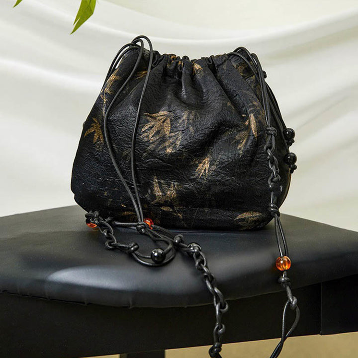 Sac à bandoulière en acétate à motif de feuilles de bambou jaune Buddha Stones