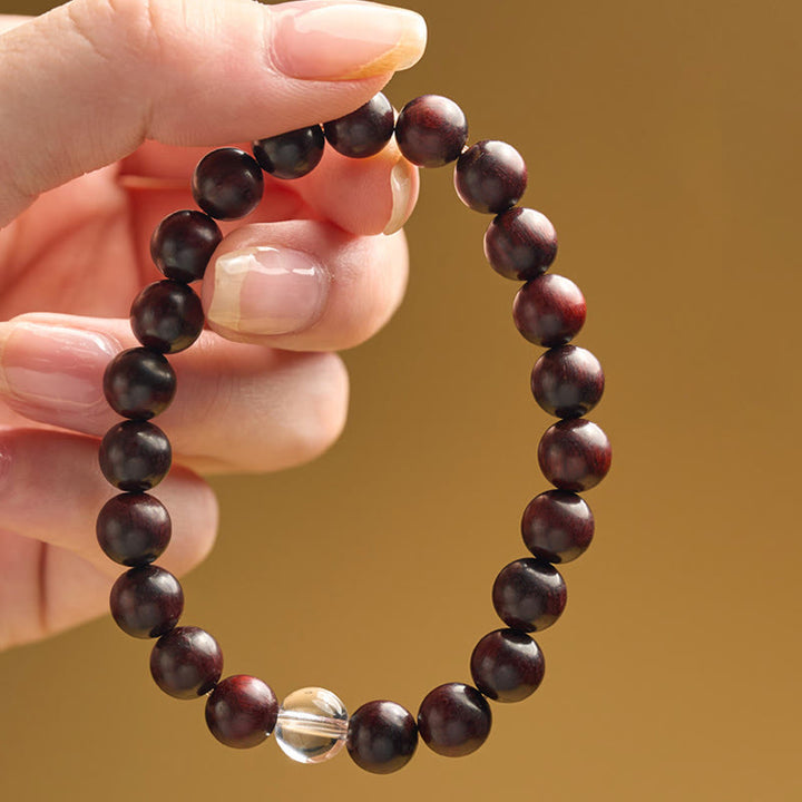 Bracelet de protection en cristal blanc et bois de santal rouge à petites feuilles de Buddha Stones