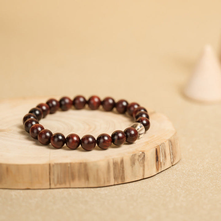 Bracelet de protection en cristal blanc et bois de santal rouge à petites feuilles de Buddha Stones
