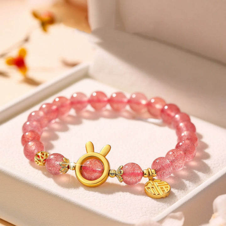 Bracelet de guérison en cristal rose avec personnage Fu et quartz fraise Buddha Stones