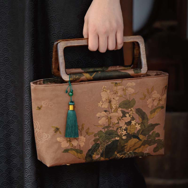 Sac à main vintage en Buddha Stones avec fleurs brunes et feuilles de bambou vertes et poignées en bois et fermeture éclair