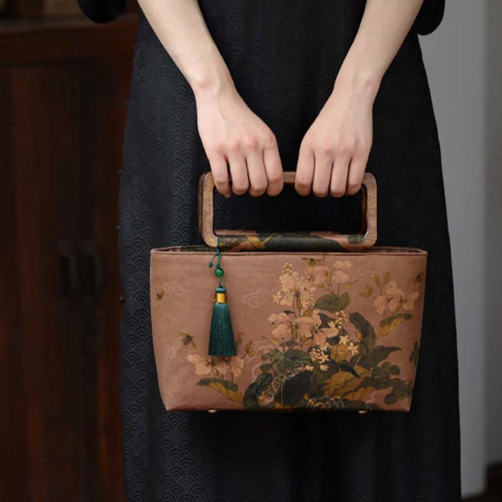 Sac à main vintage en Buddha Stones avec fleurs brunes et feuilles de bambou vertes et poignées en bois et fermeture éclair