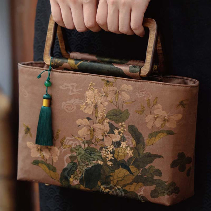 Sac à main vintage en Buddha Stones avec fleurs brunes et feuilles de bambou vertes et poignées en bois et fermeture éclair