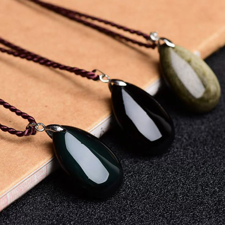 Collier pendentif goutte d'eau en obsidienne noire et dorée avec Buddha Stones