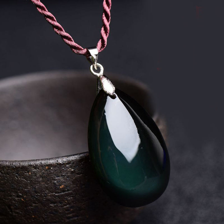 Collier pendentif goutte d'eau en obsidienne noire et dorée avec Buddha Stones