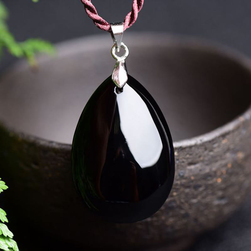 Collier pendentif goutte d'eau en obsidienne noire et dorée avec Buddha Stones