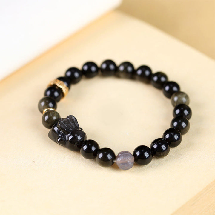 Bracelet de protection lapin mignon en Buddha Stones dorée et brillante en obsidienne noire et argentée