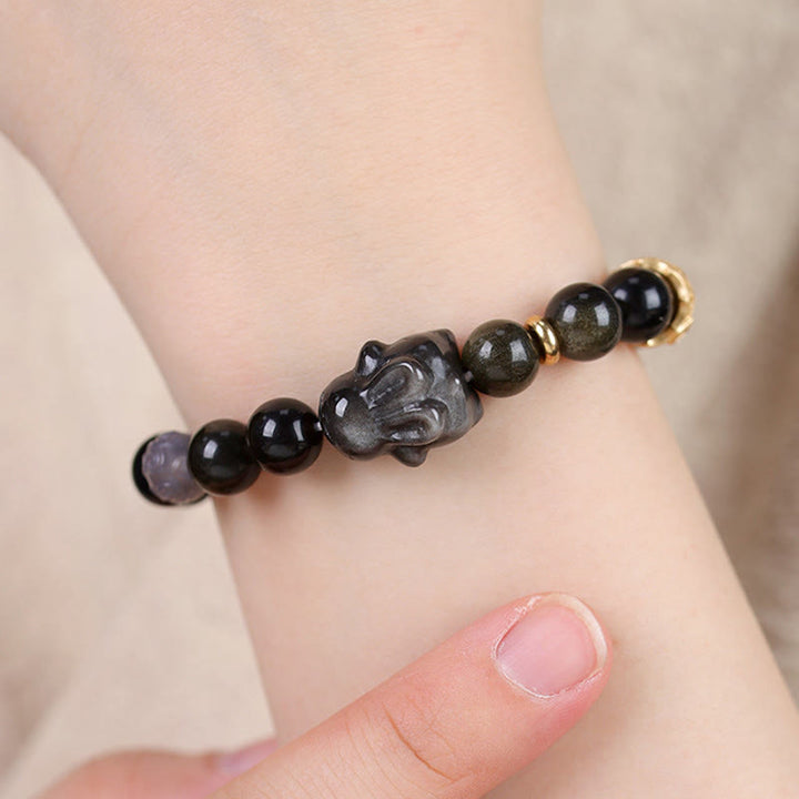 Bracelet de protection lapin mignon en Buddha Stones dorée et brillante en obsidienne noire et argentée