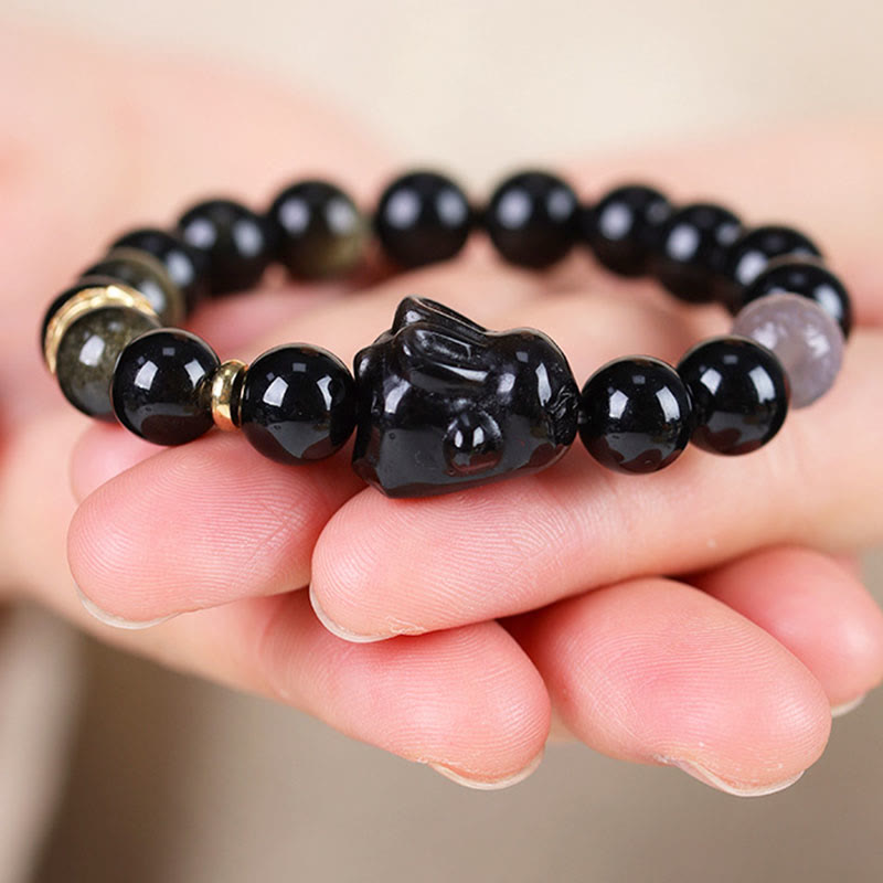 Bracelet de protection lapin mignon en Buddha Stones dorée et brillante en obsidienne noire et argentée