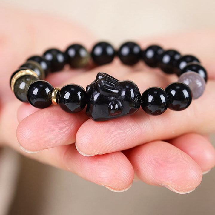 Bracelet de protection lapin mignon en Buddha Stones dorée et brillante en obsidienne noire et argentée