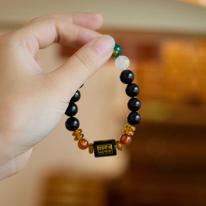 Bracelet de sagesse et de richesse en onyx noir et agate rouge avec cinq éléments de Buddha Stones