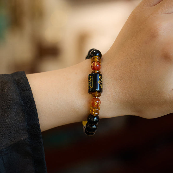 Bracelet de sagesse et de richesse en onyx noir et agate rouge avec cinq éléments de Buddha Stones