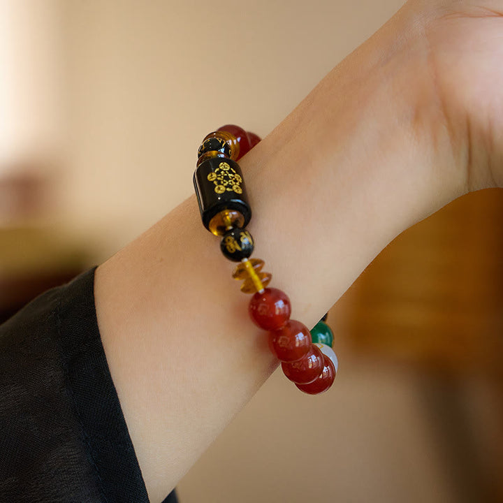 Bracelet de sagesse et de richesse en onyx noir et agate rouge avec cinq éléments de Buddha Stones