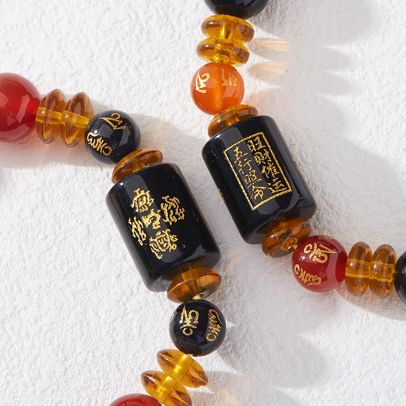 Bracelet de sagesse et de richesse en onyx noir et agate rouge avec cinq éléments de Buddha Stones