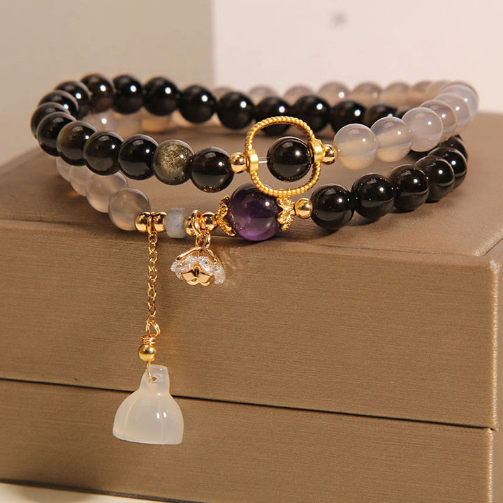 Bracelet double tour renforcé avec breloque en obsidienne grise et agate et lotus en Buddha Stones