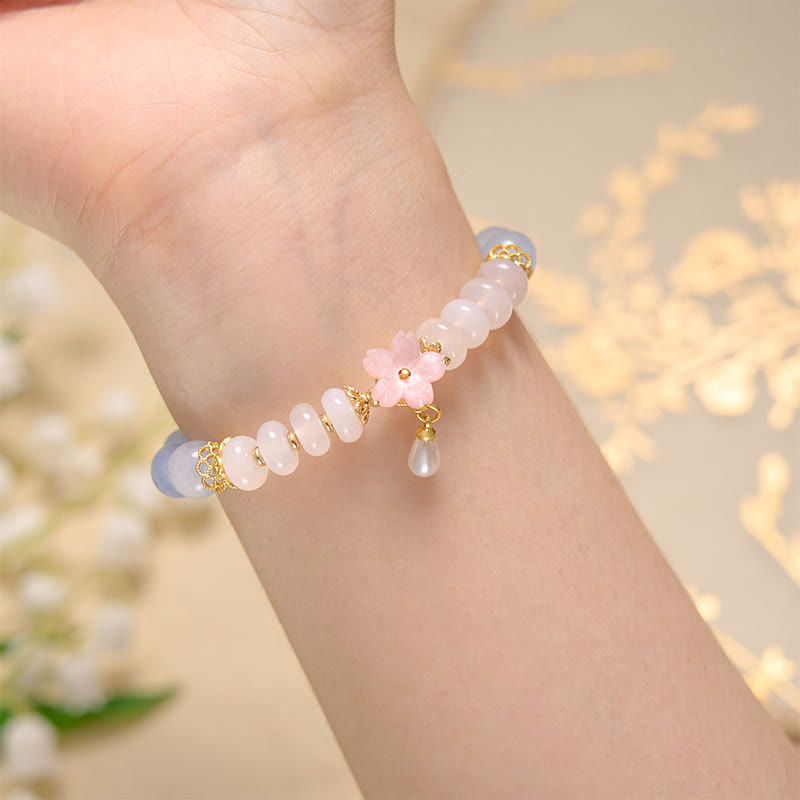 Bracelet de guérison en forme de fleur avec perles d'agate blanche et aigue-marine en Buddha Stones