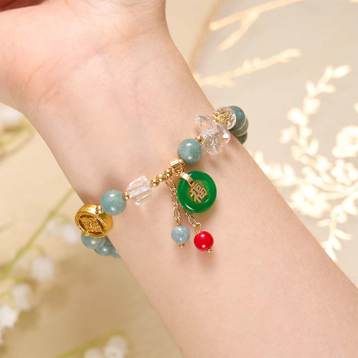 Bracelet de guérison à breloques en jade et quartz fraise Buddha Stones