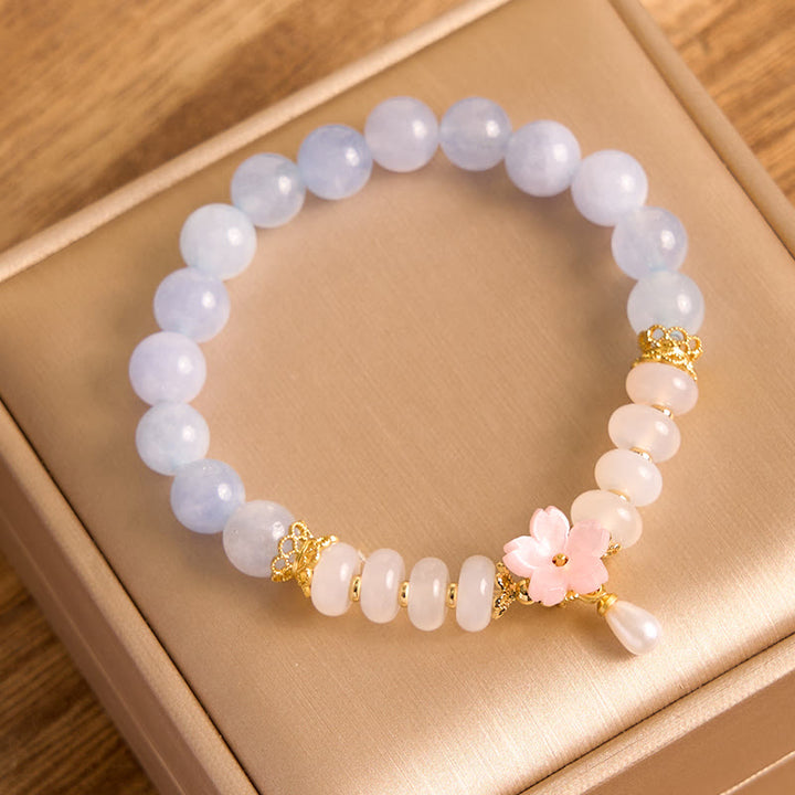 Bracelet de guérison en forme de fleur avec perles d'agate blanche et aigue-marine en Buddha Stones