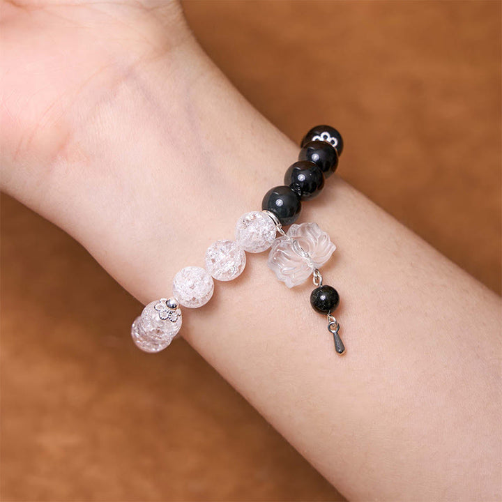 Bracelet de protection Yin Yang Lotus en quartz transparent craquelé et obsidienne argentée et brillante de Buddha Stones