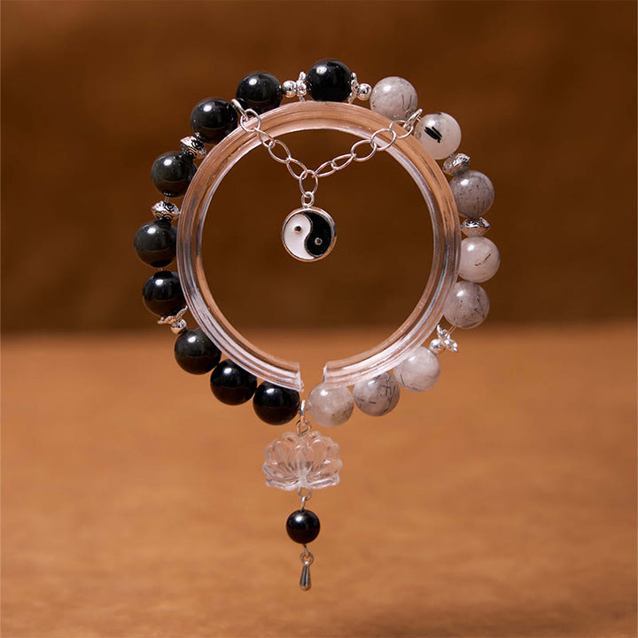 Bracelet de protection Yin Yang Lotus en quartz transparent craquelé et obsidienne argentée et brillante de Buddha Stones