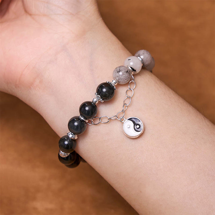 Bracelet de protection Yin Yang Lotus en quartz transparent craquelé et obsidienne argentée et brillante de Buddha Stones