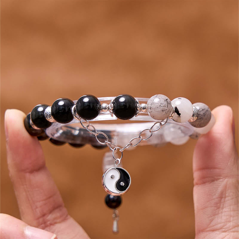 Bracelet de protection Yin Yang Lotus en quartz transparent craquelé et obsidienne argentée et brillante de Buddha Stones