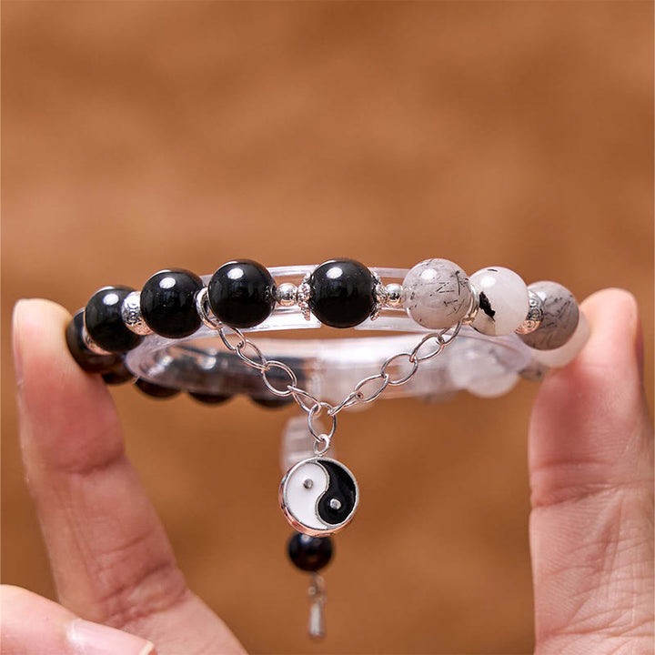 Bracelet de protection Yin Yang Lotus en quartz transparent craquelé et obsidienne argentée et brillante de Buddha Stones