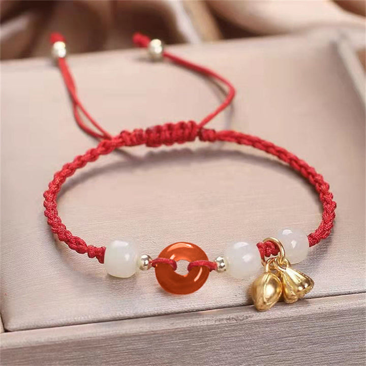Bracelet tressé de guérison en jade et lotus avec boucle de paix en agate rouge et Buddha Stones