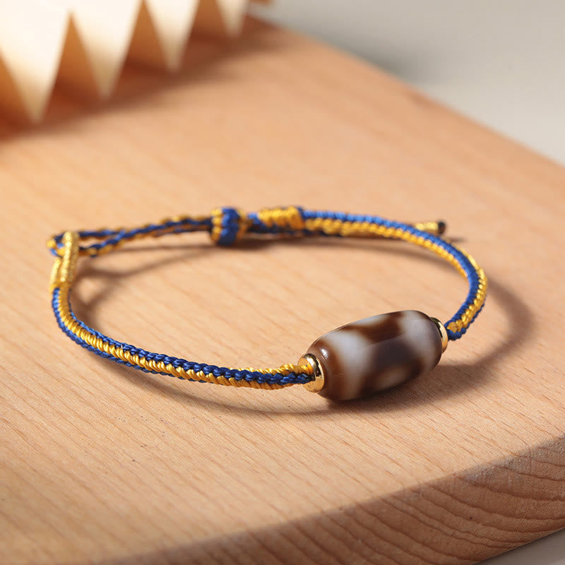 Bracelet tibétain en perles dzi à trois yeux avec Buddha Stones