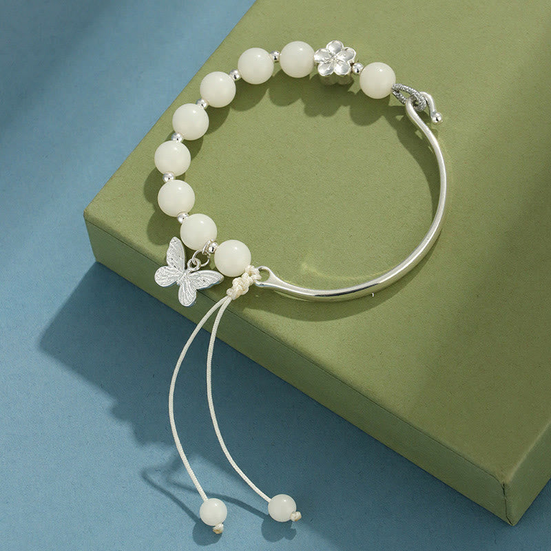 Bracelet jonc porte-bonheur en pierres de Buddha Stones et graines de Bodhi, papillon, lotus