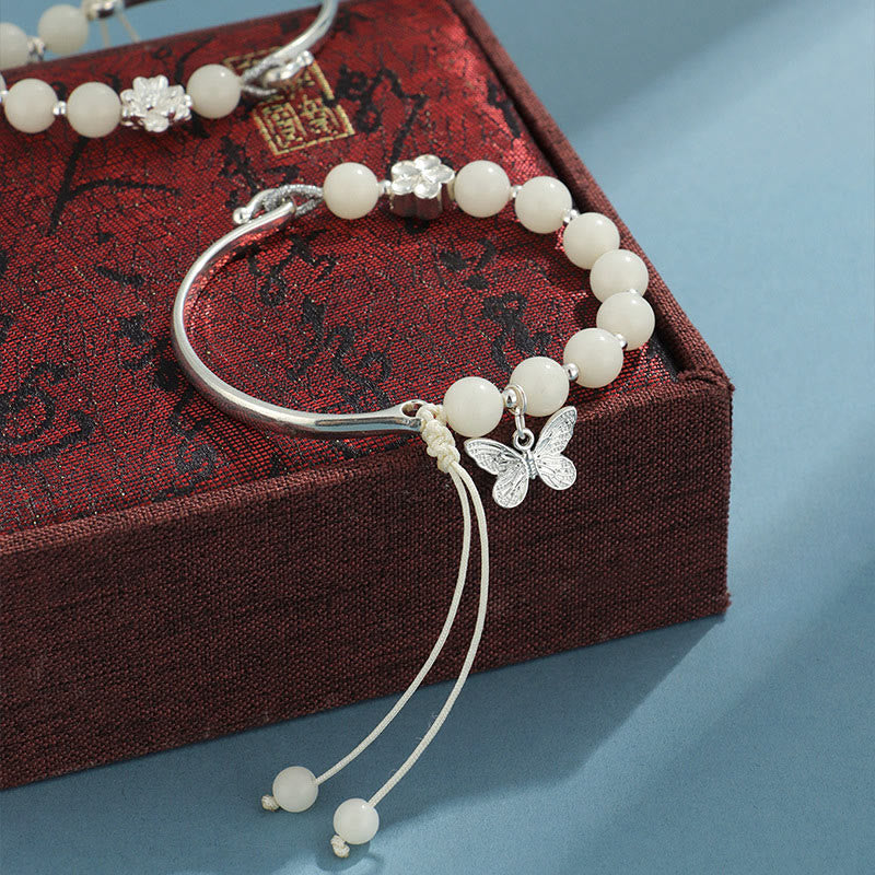 Bracelet jonc porte-bonheur en pierres de Buddha Stones et graines de Bodhi, papillon, lotus