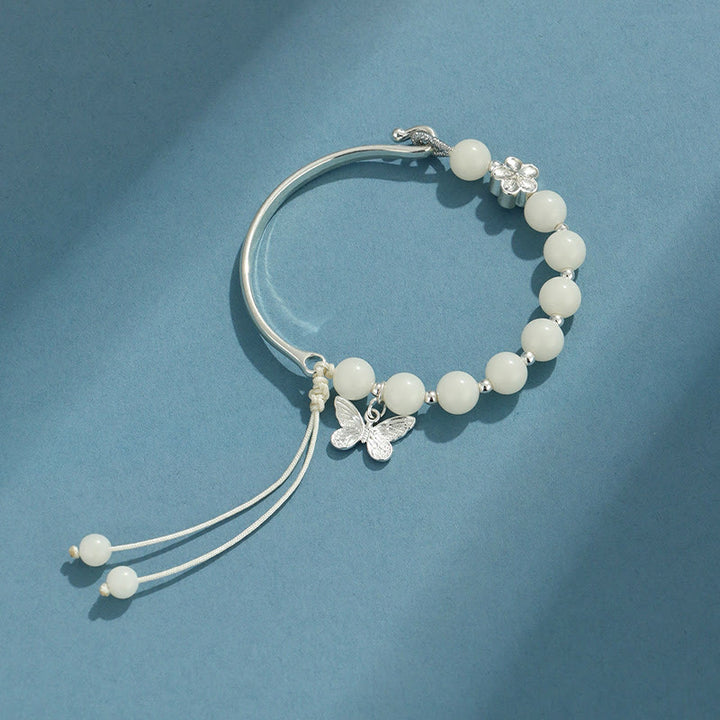 Bracelet jonc porte-bonheur en pierres de Buddha Stones et graines de Bodhi, papillon, lotus