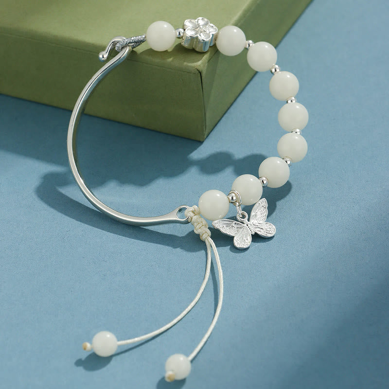 Bracelet jonc porte-bonheur en pierres de Buddha Stones et graines de Bodhi, papillon, lotus