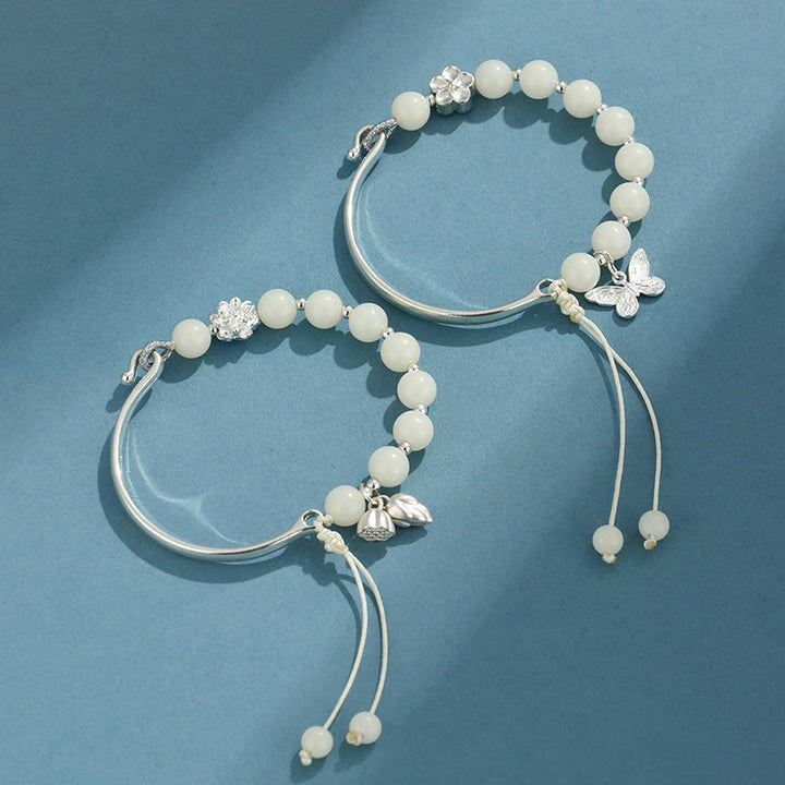 Bracelet jonc porte-bonheur en pierres de Buddha Stones et graines de Bodhi, papillon, lotus