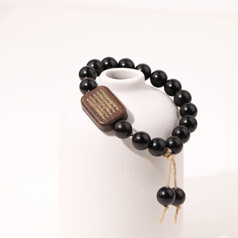 Bracelet de paix gravé en bois d'ébène avec Buddha Stones
