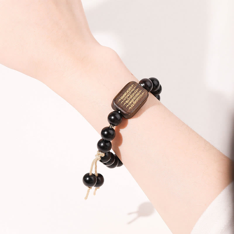 Bracelet de paix gravé en bois d'ébène avec Buddha Stones