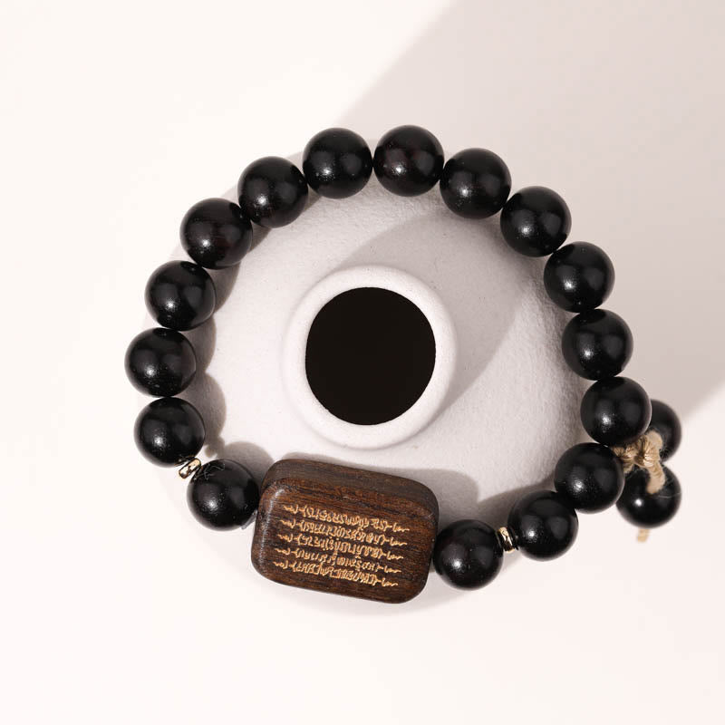 Bracelet de paix gravé en bois d'ébène avec Buddha Stones
