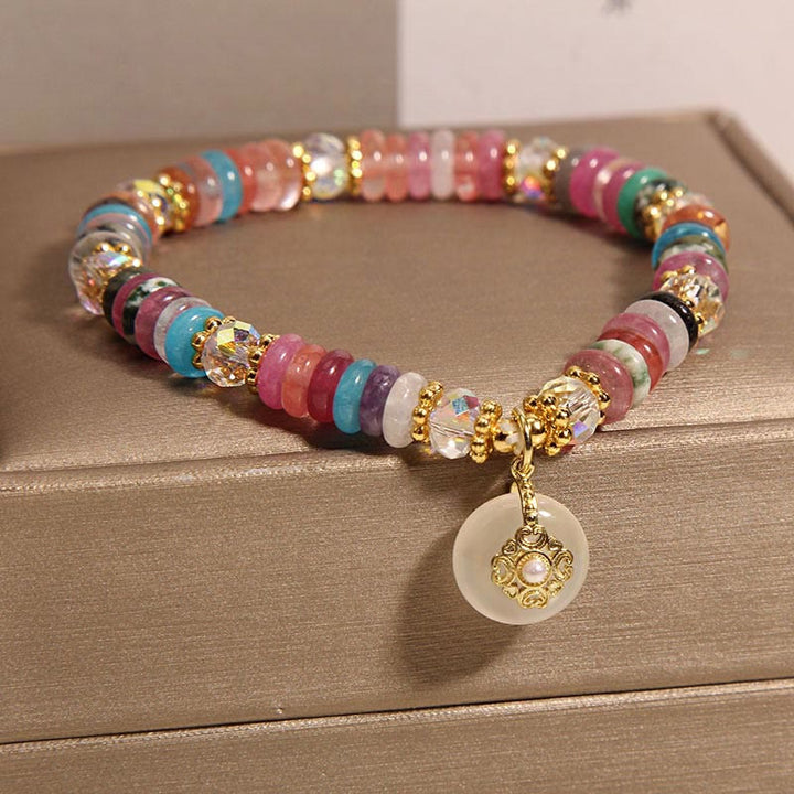 Bracelet de bon augure avec boucle de paix en quartz fraise et Buddha Stones