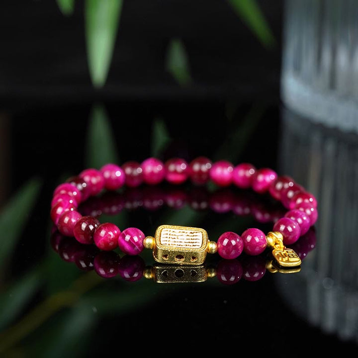 Bracelet de courage avec personnage Fu en œil de tigre rose et rouge Buddha Stones