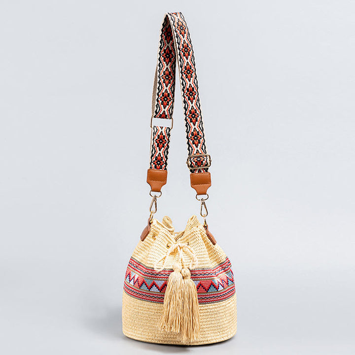 Sac à bandoulière en paille tissée avec pompons et Buddha Stones