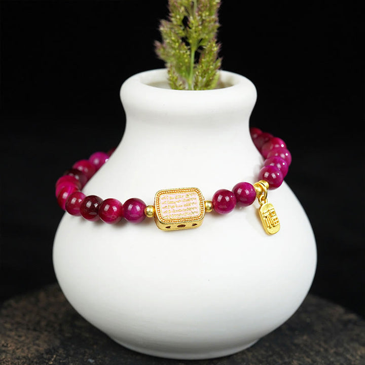 Bracelet de courage avec personnage Fu en œil de tigre rose et rouge Buddha Stones