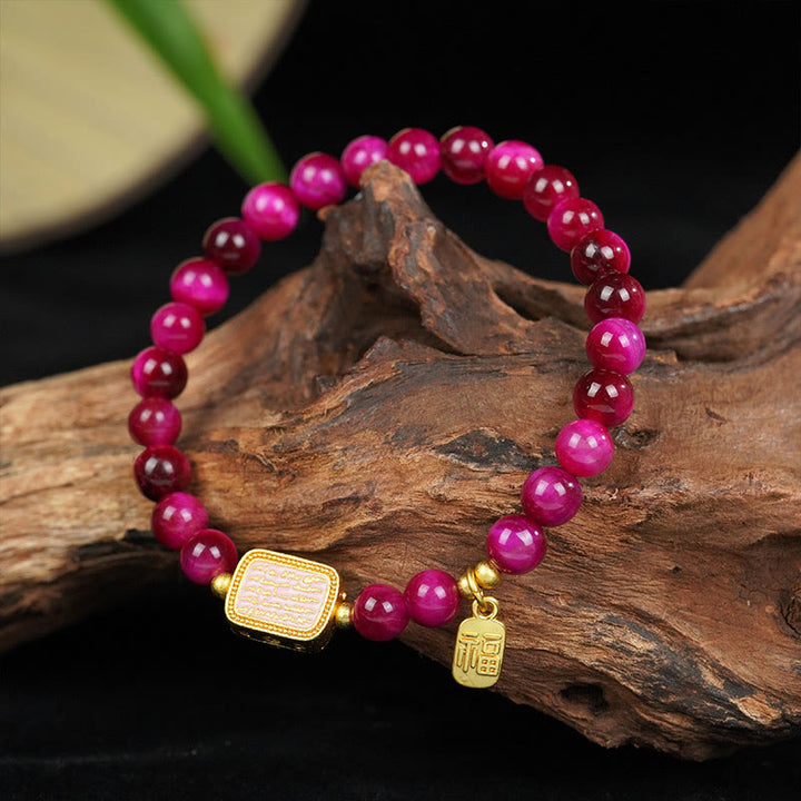 Bracelet de courage avec personnage Fu en œil de tigre rose et rouge Buddha Stones
