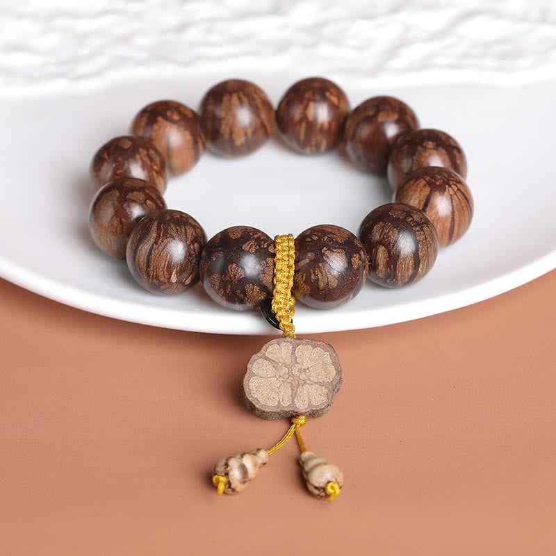 Bracelet de paix intérieure en bois de fleur de prunier et Buddha Stones