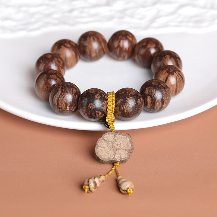 Bracelet de paix intérieure en bois de fleur de prunier et Buddha Stones