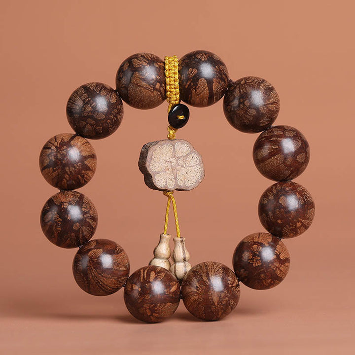 Bracelet de paix intérieure en bois de fleur de prunier et Buddha Stones