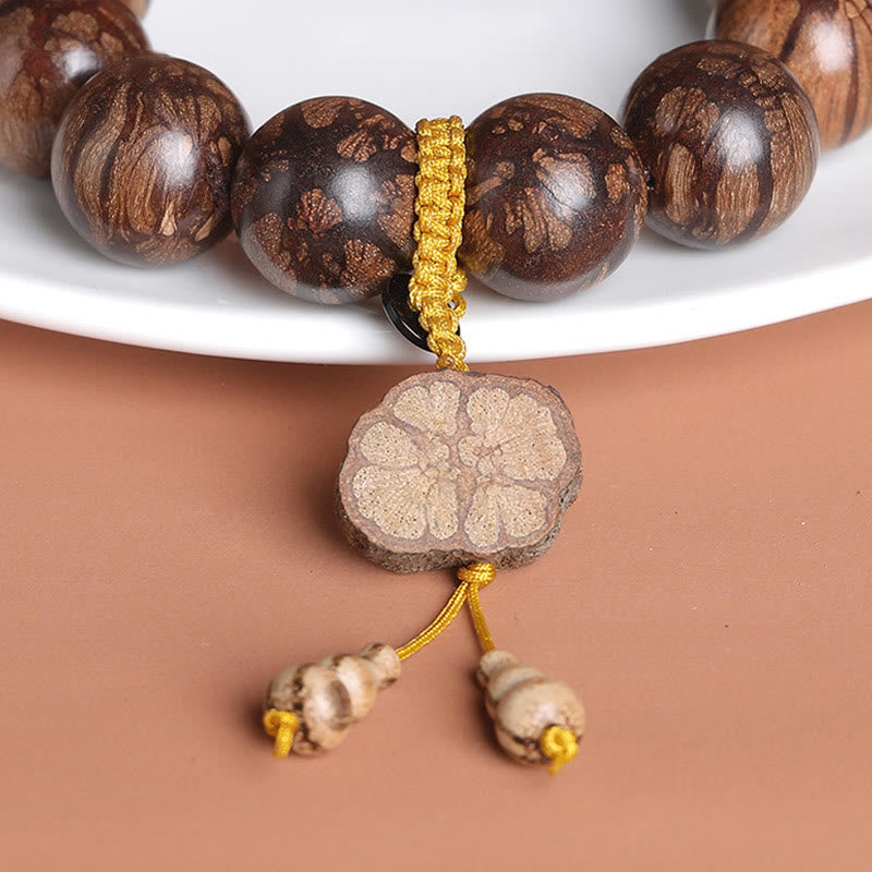 Bracelet de paix intérieure en bois de fleur de prunier et Buddha Stones