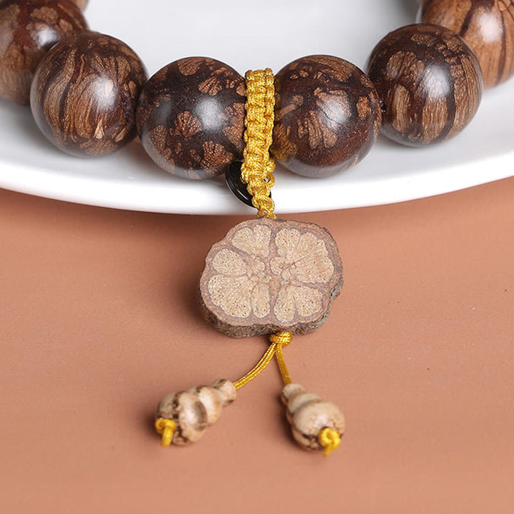 Bracelet de paix intérieure en bois de fleur de prunier et Buddha Stones