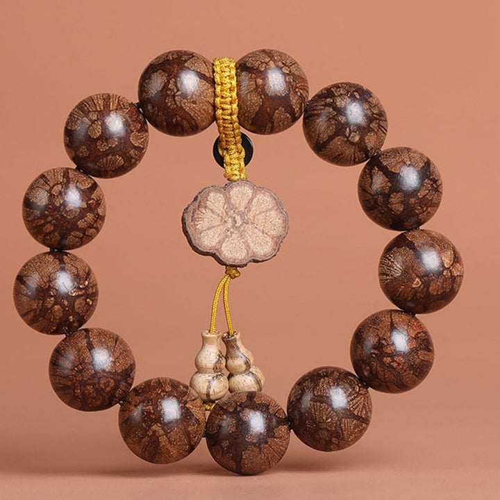 Bracelet de paix intérieure en bois de fleur de prunier et Buddha Stones