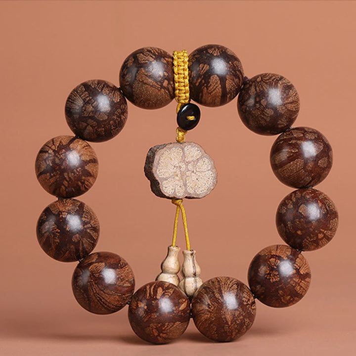 Bracelet de paix intérieure en bois de fleur de prunier et Buddha Stones
